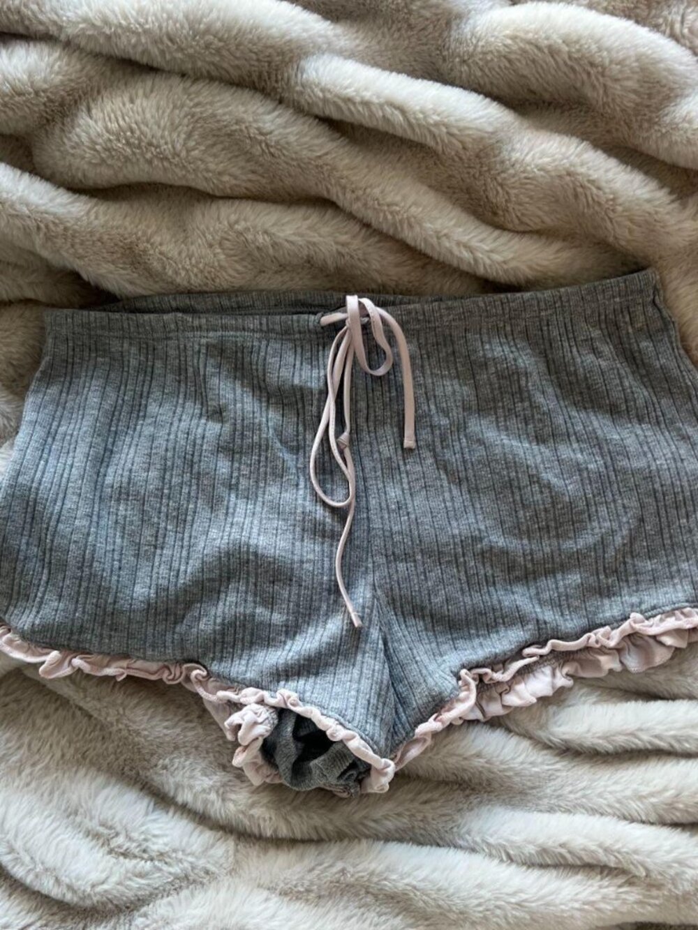 Victoria’s secret grey and pink pj shorts with cute ruffle edge on the bottom.